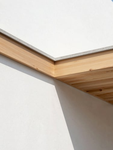 Macro architectural detail of a clean timber-to-concrete junction, sharp daylight, raw materials in sharp focus, minimalist composition
