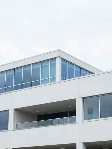 Bright modern Pacific Northwest office environment, natural overcast daylight, clean white and blue tones, architectural focus, 35mm lens