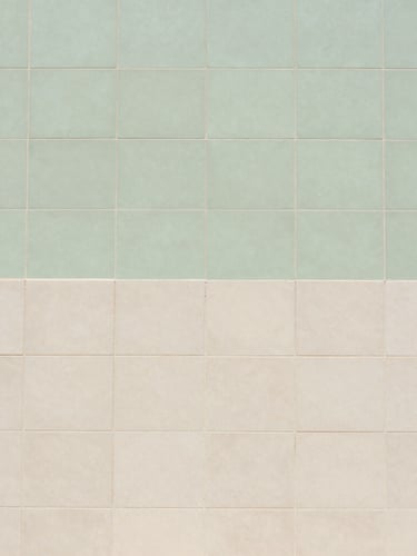 editorial architectural photography of tile substrate preparation with a green uncoupling membrane, clean lines, bright daylight, 35mm