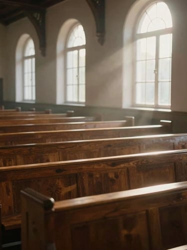 Wide environmental shot of a quiet chapel interior at dawn, soft morning window light cutting through dust motes, casting long shadows across empty wooden pews, unposed and silent.