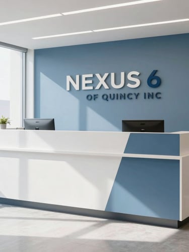Bright, modern office interior, focus on a clean reception area with NEXUS 6 OF QUINCY INC branding subtly visible, natural light streaming in, professional and organized.