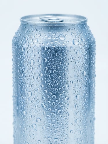 Macro close-up of a condensation-beaded aluminum can of vitaaqua water, sharp focus, cool blue studio lighting, minimalist white backdrop, 50mm