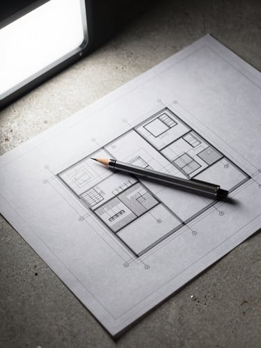 Close-up overhead shot of a detailed structural blueprint spread flat on a raw concrete surface, a single mechanical pencil resting precisely at a dimension line, harsh studio strobe lighting from upper left, no hands, no people, ultra-sharp technical linework visible