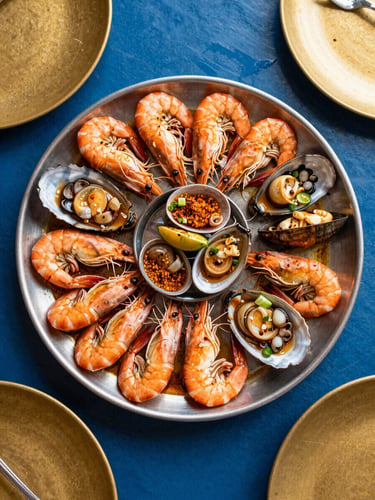 Overhead flat-lay of a premium Bangladeshi seafood BBQ platter, glistening with spices, warm dining light, 35mm