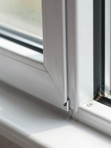 Macro close-up of a perfectly sealed aluminum window corner joint, clean caulking, bright natural daylight, showing high structural quality
