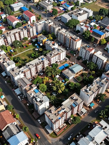 Aerial drone view of a structured residential layout in OMR Chennai, sharp layout boundaries, bright natural daylight, objective environmental framing.