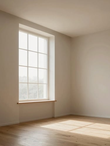 Soft natural morning light filtering through a tall window into a clean, empty room with high ceilings and light wooden floors, minimalist and peaceful vibe, 35mm lens
