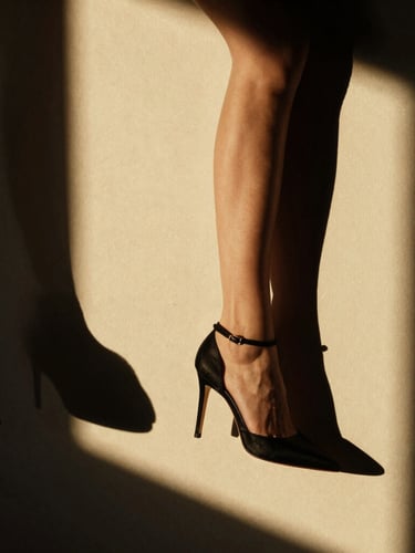 Dramatic high-contrast fashion photography close-up, sharp key light, deep obsidian shadows, golden-hour warmth