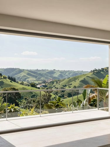 Wide-angle architectural shot of a luxury villa balcony overlooking a lush green valley, with high-tensile stainless steel invisible grills perfectly framed under bright daylight
