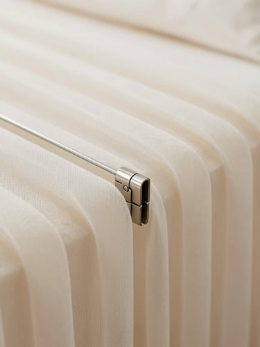 Macro architectural photograph focusing on the tension wire joints and folding hinges of a pleated mesh system, clean minimalist luxury aesthetic, sharp focus on the metallic components.