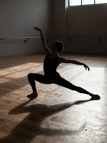 Wide architectural rehearsal space bathed in high-contrast side-lighting, a solitary dancer's silhouette demonstrating extreme physical tension in a deep lunge, stark shadows on a wooden floor.