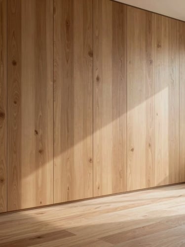 An architectural crop of bespoke floor-to-ceiling timber wall paneling in a minimalist room, soft daylight casting long shadows across the textured grain