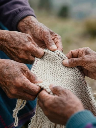Close-up of hands of different generations holding a hand-woven wool textile from Boyacá, natural mountain light, warm tones