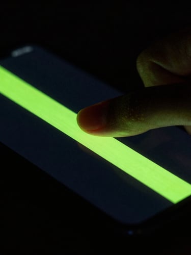 Macro shot of a thumb executing a swift edge-swipe gesture on a dark smartphone screen, neon green trail, high-contrast screen glow