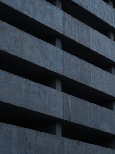 Minimalist close-up of architectural lines, concrete and steel structure, cool diffused daylight, high contrast, 35mm.