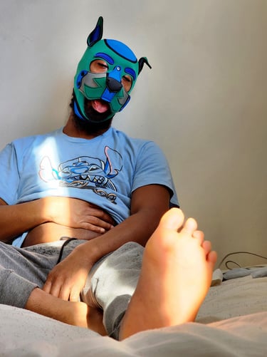 Man relaxing in his pup mask.