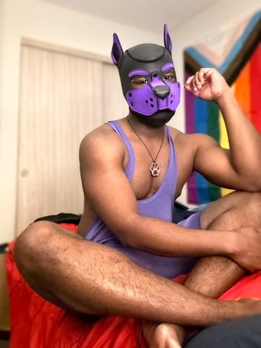 Man relaxing in a pup mask.