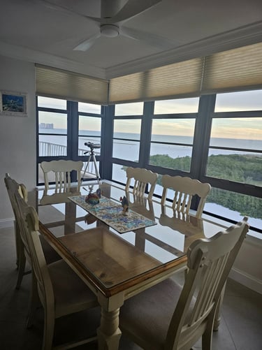 a dining room table with chairs and a table
