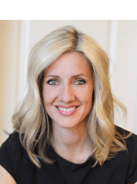 a woman with blonde hair and a black top - Cherstyn Stockwell