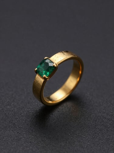 Macro shot of a deep green emerald being set into a hand-hammered gold band, dark charcoal background