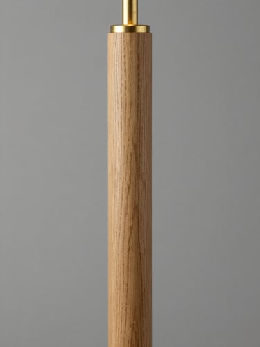 Turned oak floor lamp column with visible wood grain and internal brass fittings, clean architectural studio lighting, 35mm