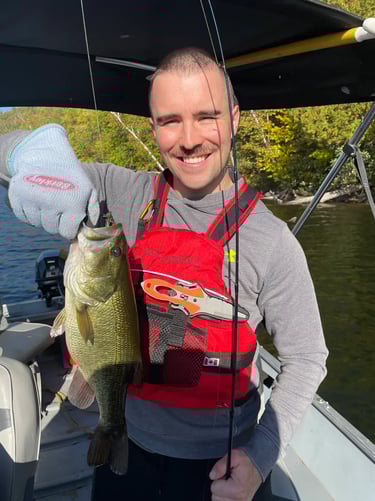 client caught large bass after fishing lessons in lake near Ottawa