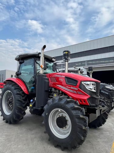 a red tractor with a large wheel on it