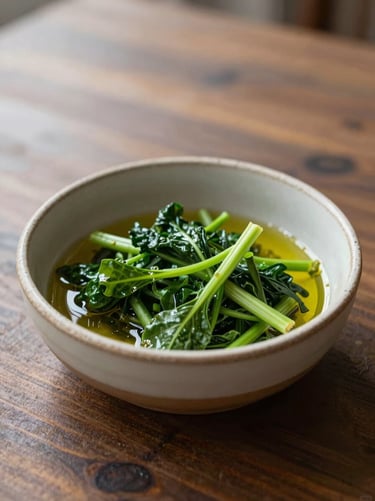 A rustic ceramic bowl filled with fresh green vegetables and olive oil on a dark wooden table, soft side-light, 35mm lens.