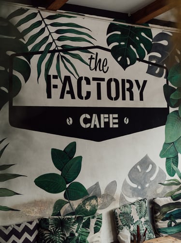 a wall mural of a plant life in a cafe