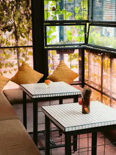 a table with two tables and a window