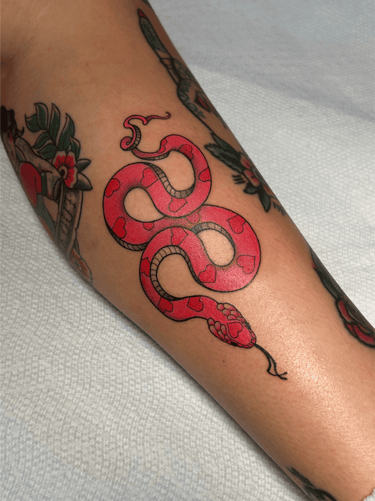 american traditional full color snake feminine tattoo
