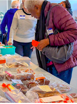 a woman is looking at a display of jewelry