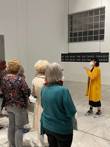 Asimina Georgakopoulou as art mediator on a guided tour of the Portals exhibition (NEON Organization