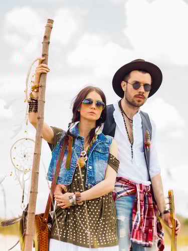 a man and woman standing in the desert