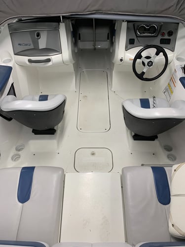 Boat interior before SeaDek installation showing worn factory flooring prior to Vital Marine upgrade