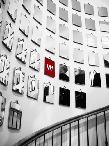 a wall of mirrors with a red light on it