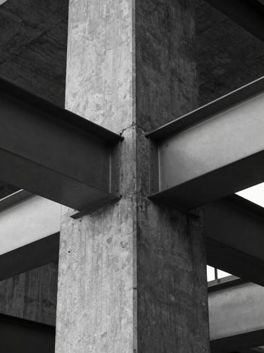 Abstract architectural detail of a concrete pillar and steel beam, high-contrast black and white, clinical lighting, geometric symmetry.