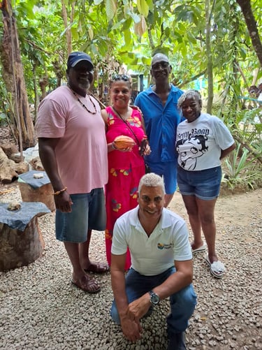 group of happy tourists posing in a garden during a punta cana local tour