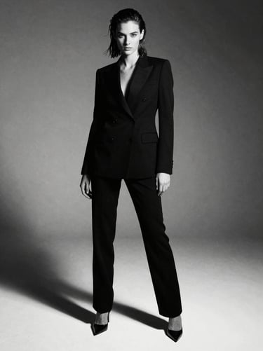 Editorial fashion tearsheet, high-contrast studio lighting, dramatic shadows