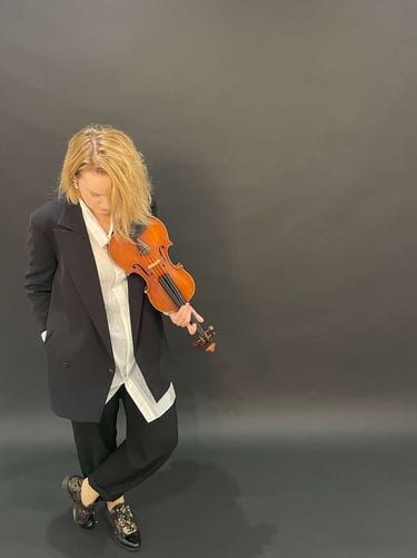 Contemporary portrait of violinist Zydre holding a violin, interdisciplinary classical music artist