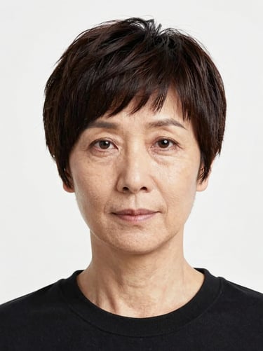 Professional portrait of a senior cosmetology instructor with a structured haircut, clean white background, high clarity daylight