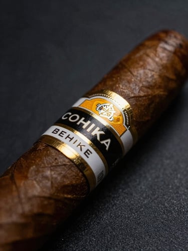 Macro shot of a textured Cohiba Behike cigar wrapper, gold and black band reflecting soft light