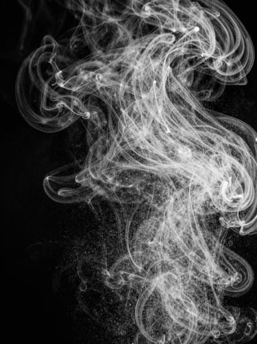 Delicate liquid mist suspended in air, macro shot, high-contrast monochrome lighting, sharp details