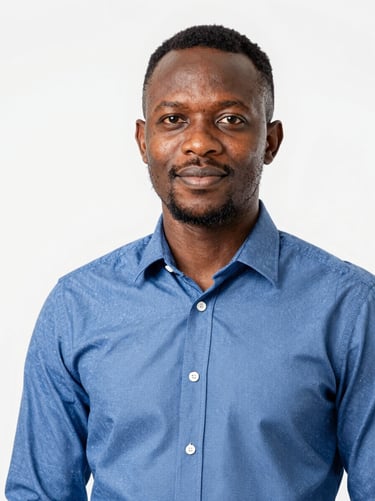 Professional portrait of a male Cameroonian technical director, confident expression, wearing a neat corporate shirt, soft studio lighting, clean background, 35mm