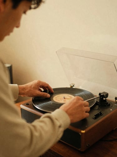 Candid shot of a man adjusting a vintage record player, warm indoor lighting, nostalgic film grain