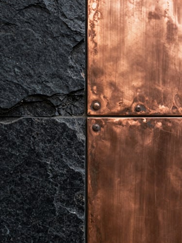 Close-up of oxidized copper panels meeting rough-hewn black basalt stone, warm light accentuating the metallic textures.