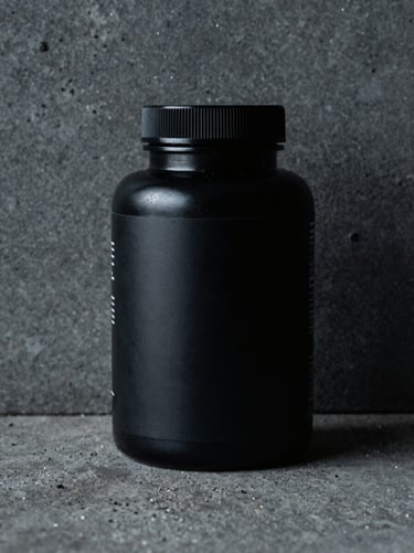 Macro shot of a premium black supplement bottle on a textured concrete surface, sharp side-lighting, high contrast, cool ambient tones.