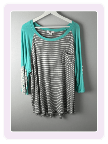 Women's gray and white striped raglan top with teal sleeves and lace elbow patches.