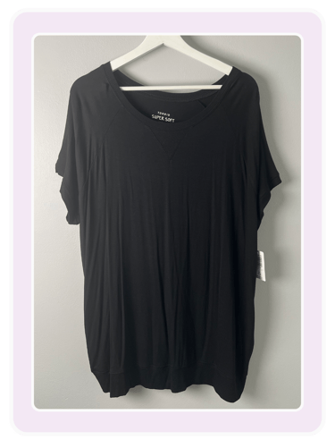 Torrid Super Soft black short sleeve t-shirt with a scoop neck on a white hanger.