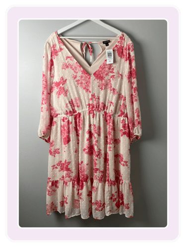 Torrid floral print long-sleeve mini dress with pink roses and Swiss dot texture on a cream fabric.